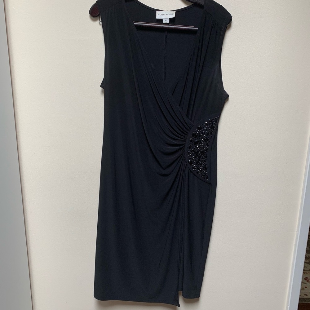 Lovely LBD with red jeweled accent at the waist.